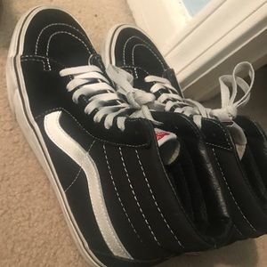 Black and white high top Vans